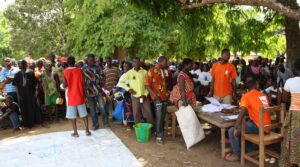 UK_Department_for_International_Development_-_Displaced_Ivorians_queue_for_food_at_a_UNHCR_distribution_site_in_Liberia